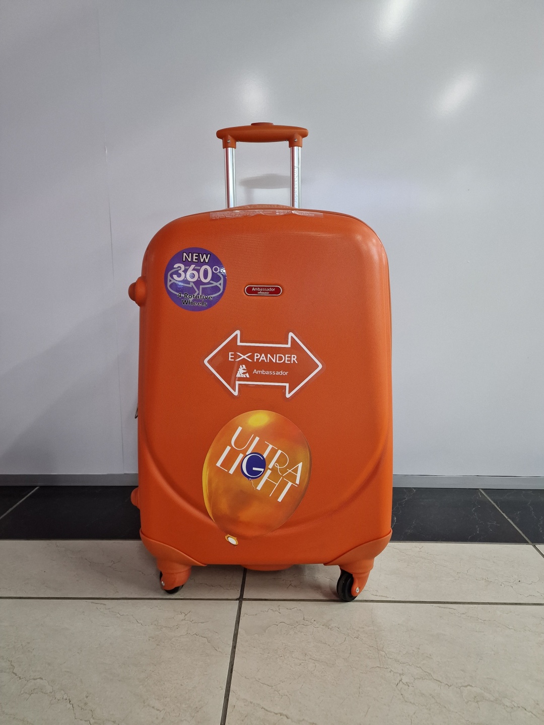 Чемодан Ambassador А8503 поликарбонат 75 л оранжевый