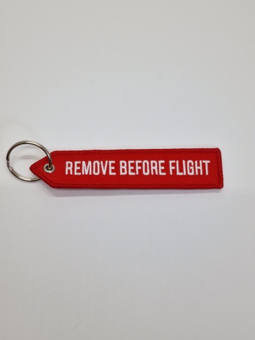 Брелок NOON Remove Before Flight 13х3 текстиль 1 шт