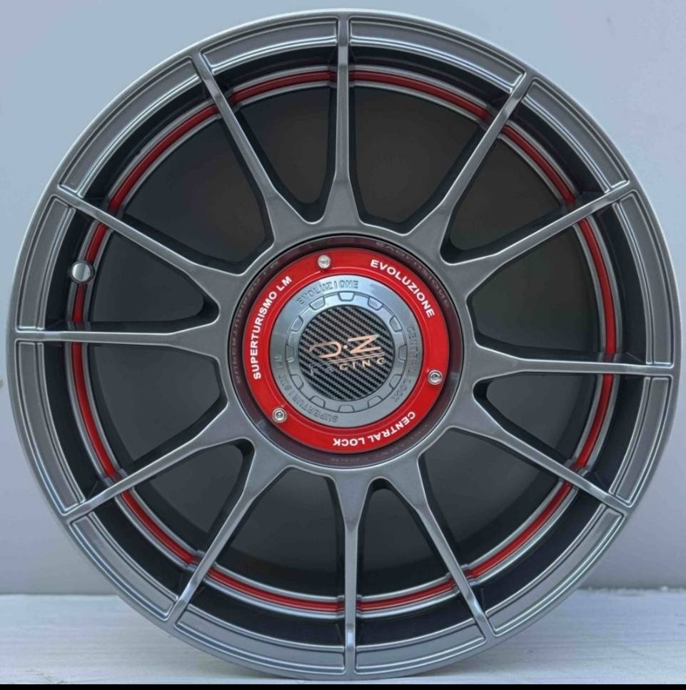 OZ Racing 997 7x15/4x100 D73.1 ET20 4 диска графит, красный, серый